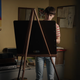 Noach Schnapp as Will in Stranger Things painting in his room